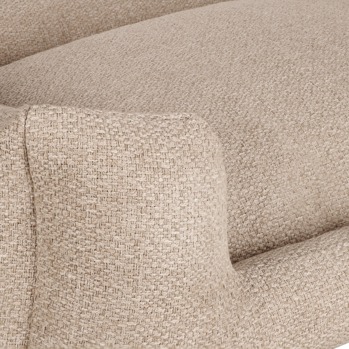 Close-up of a woven upholstery fabric in a warm light beige tone, showing the texture and color of the material.