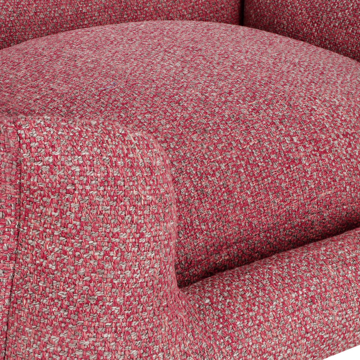 Close-up of a textured upholstery fabric in a heathered red and beige tweed pattern, showing the curved armrest and seat cushion of an armchair.