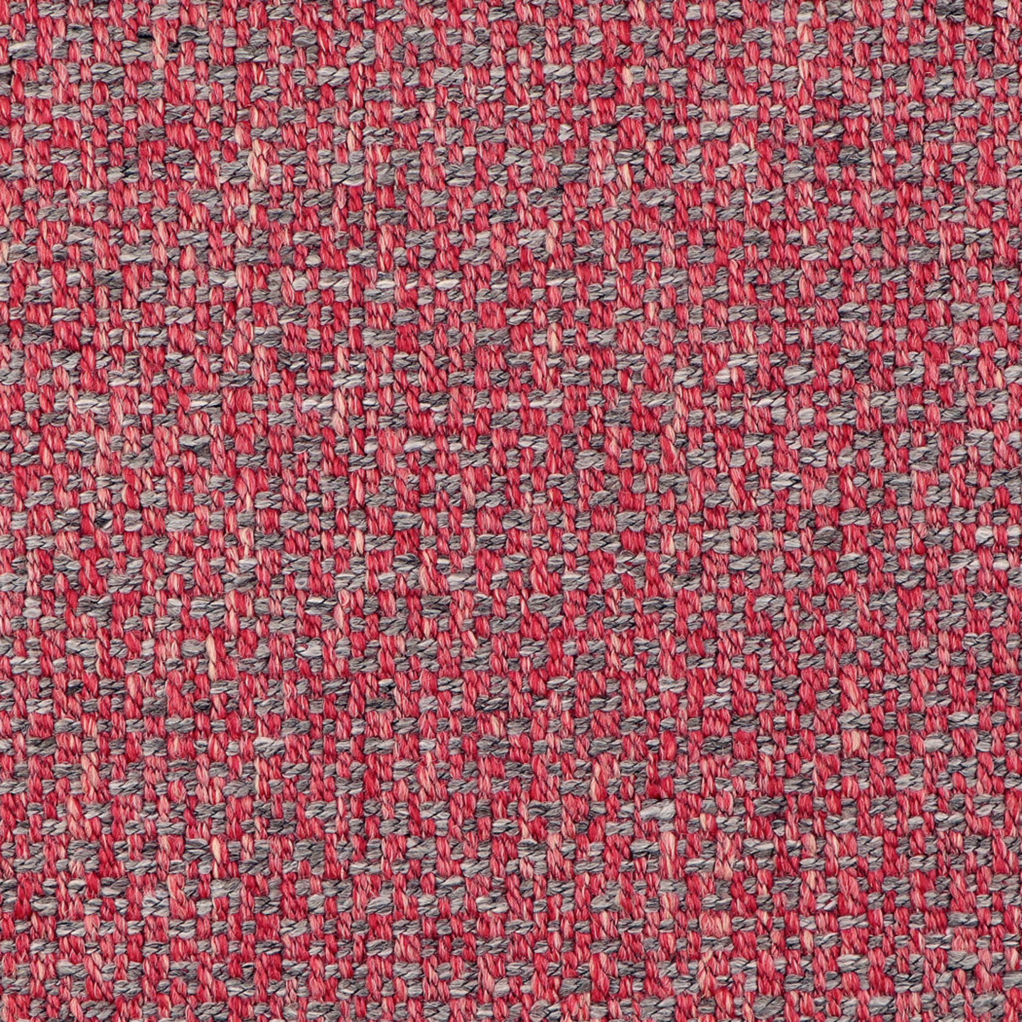 A close-up of a woven fabric texture featuring a heathered pattern of red, pink, and gray threads.
