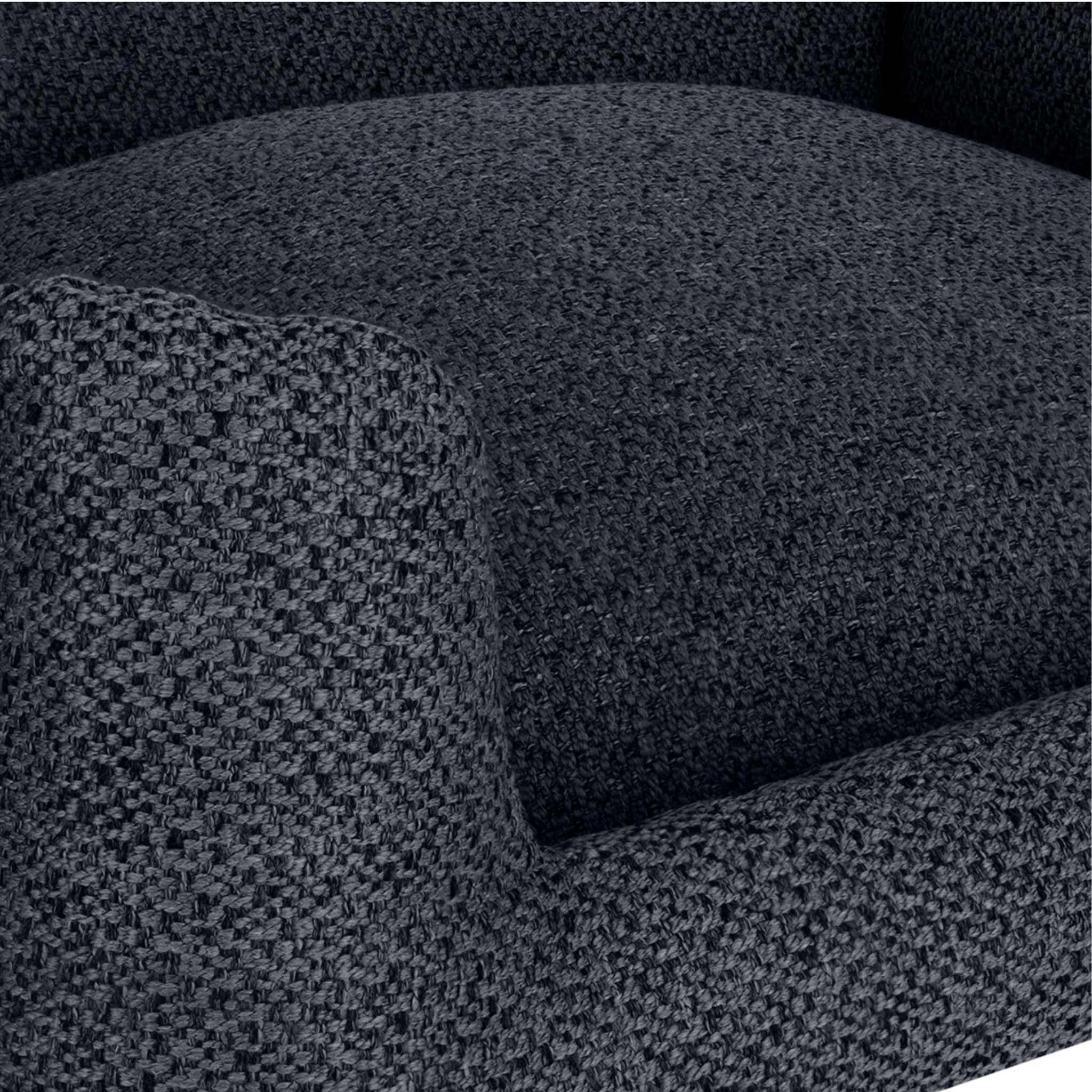 Close-up of a dark charcoal gray textured fabric armchair cushion and armrest.