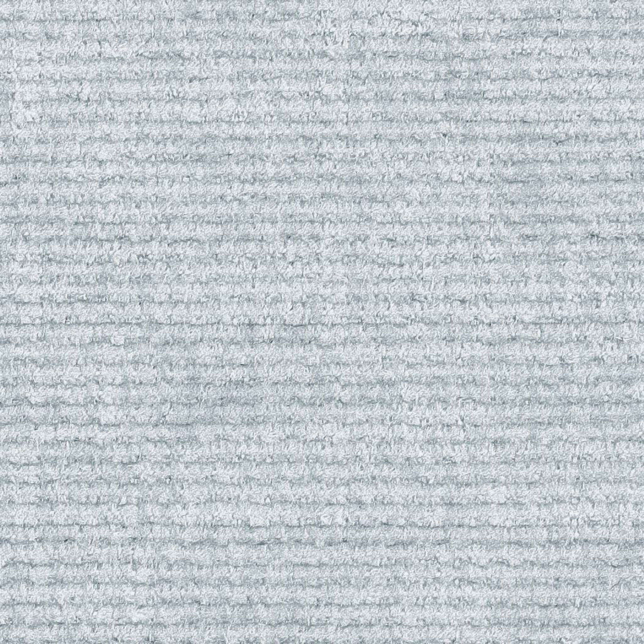 A close-up of a textured fabric or carpet sample with a ribbed, heathered pattern in light gray and white.