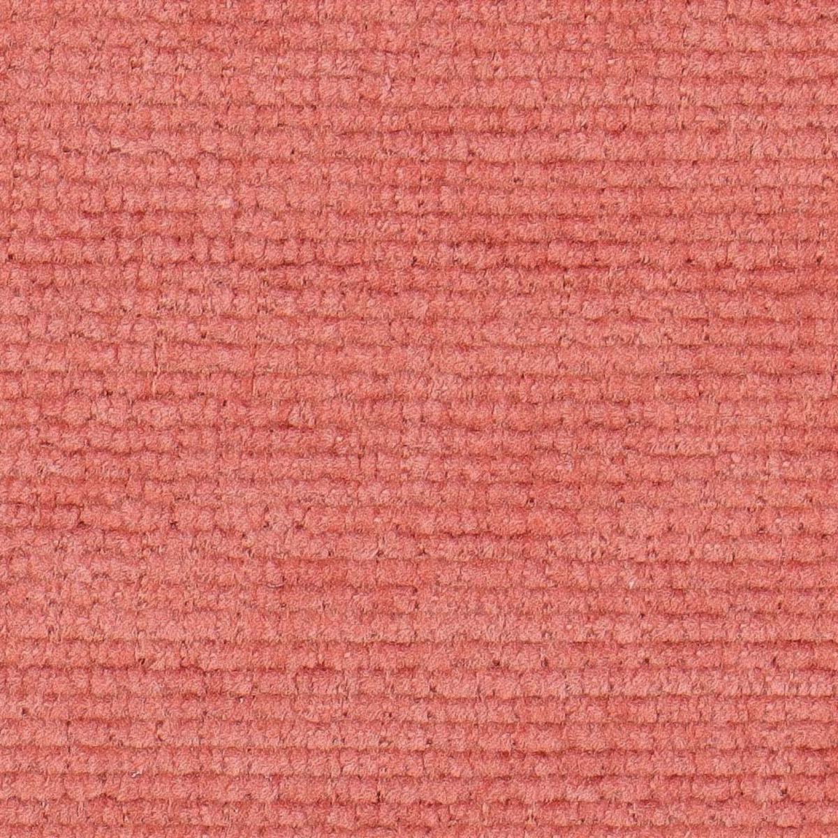 A close-up texture shot of a coral pink loop-pile carpet or fabric swatch.