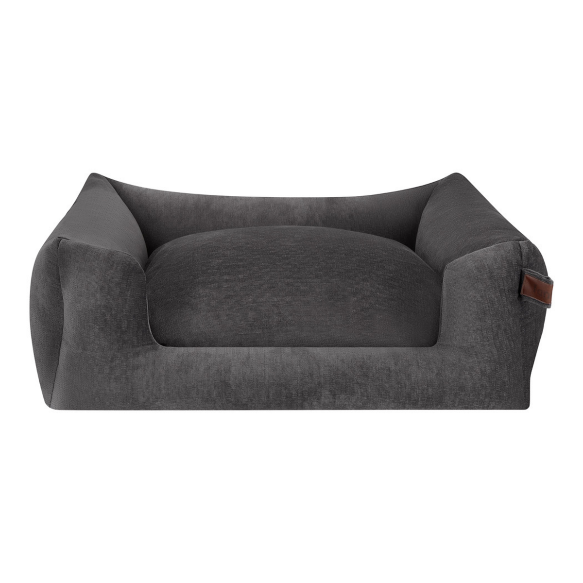 A dark gray plush velvet pet bed with a high bolstered wall and a small brown leather brand tag on the right armrest, shown against a plain white background.