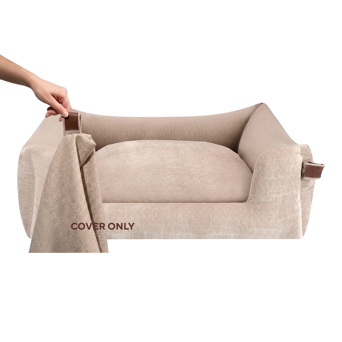 A beige pet bed with a matching fabric cover draped over the front, held by a visible hand on the left. The words 'COVER ONLY' appear on the cover.