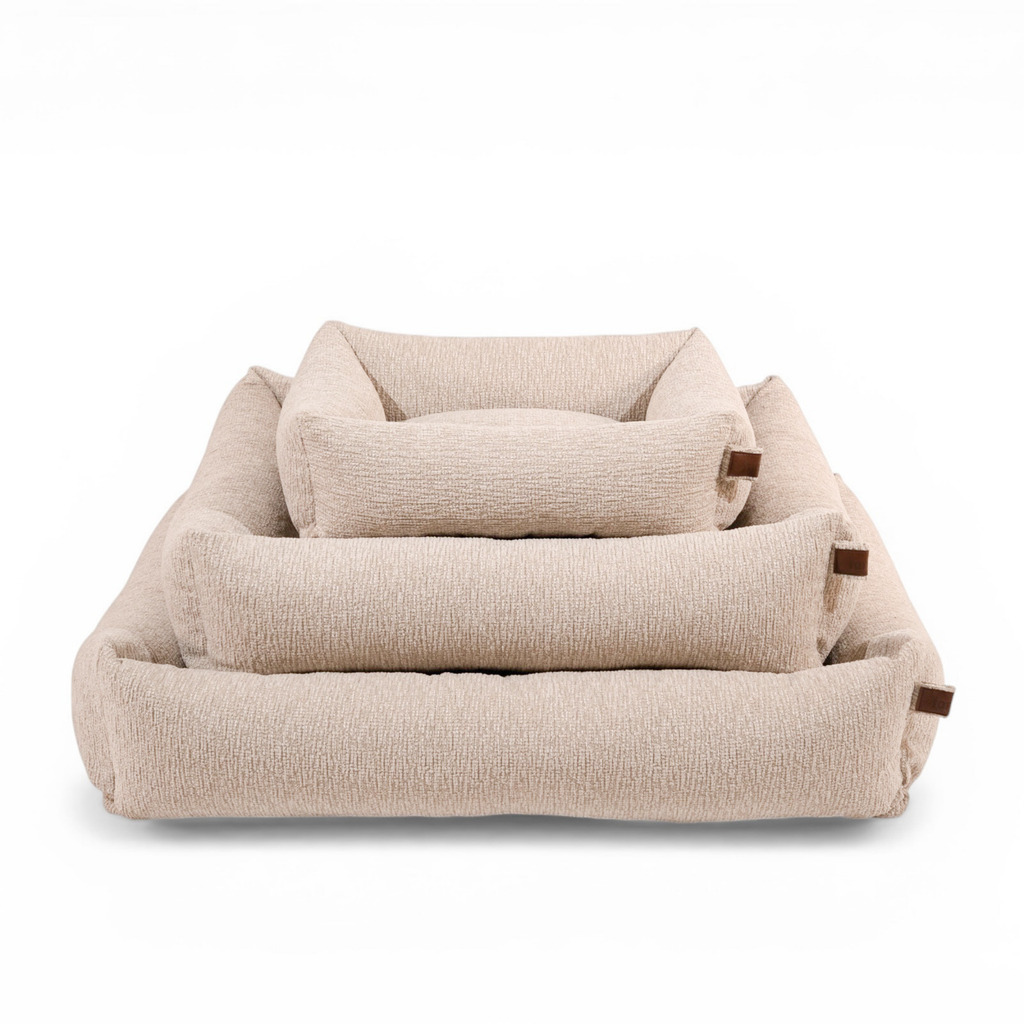 The Snug dog bed in Clay Beige in all three sizes, nested together