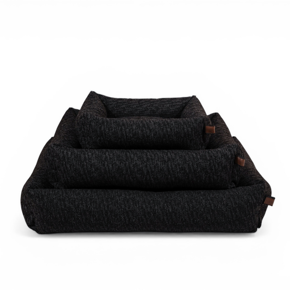 The Snug dog bed in Coal Grey in all three sizes, nested together