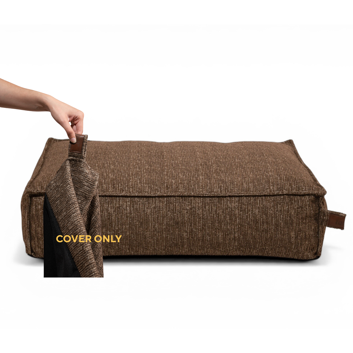 A hand lifting the removable cover off the Stargaze dog mattress in Espresso Brown, labelled Cover only