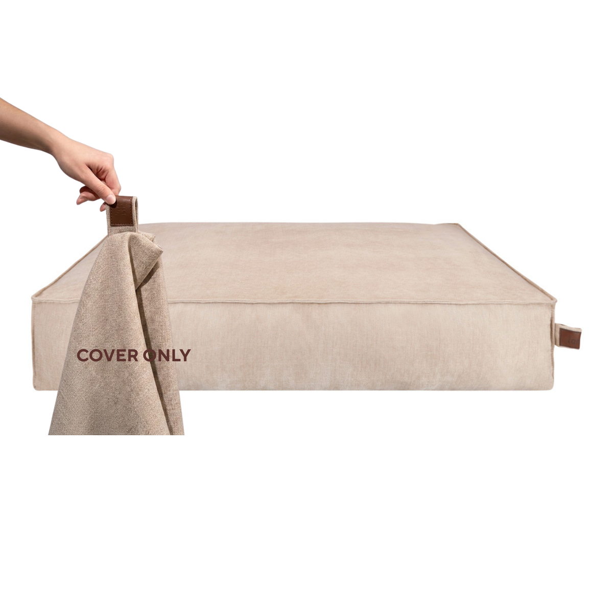 A hand lifting the removable cover off the Stargaze dog mattress in Oat Beige, labelled Cover only