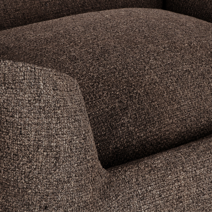 Close-up of a textured woven upholstery fabric in a dark brown and beige heathered pattern, showing the seat cushion and armrest detail.