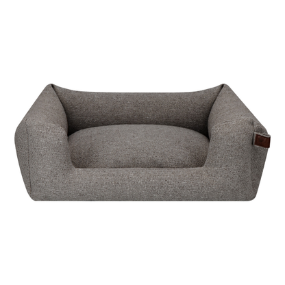 A rectangular pet bed with a high bolstered wall and a plush cushion, upholstered in a textured gray fabric, shown against a plain white background.