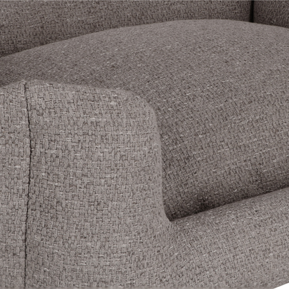Close-up of a textured gray woven fabric upholstery, showing the seat cushion and armrest with a detailed weave pattern.