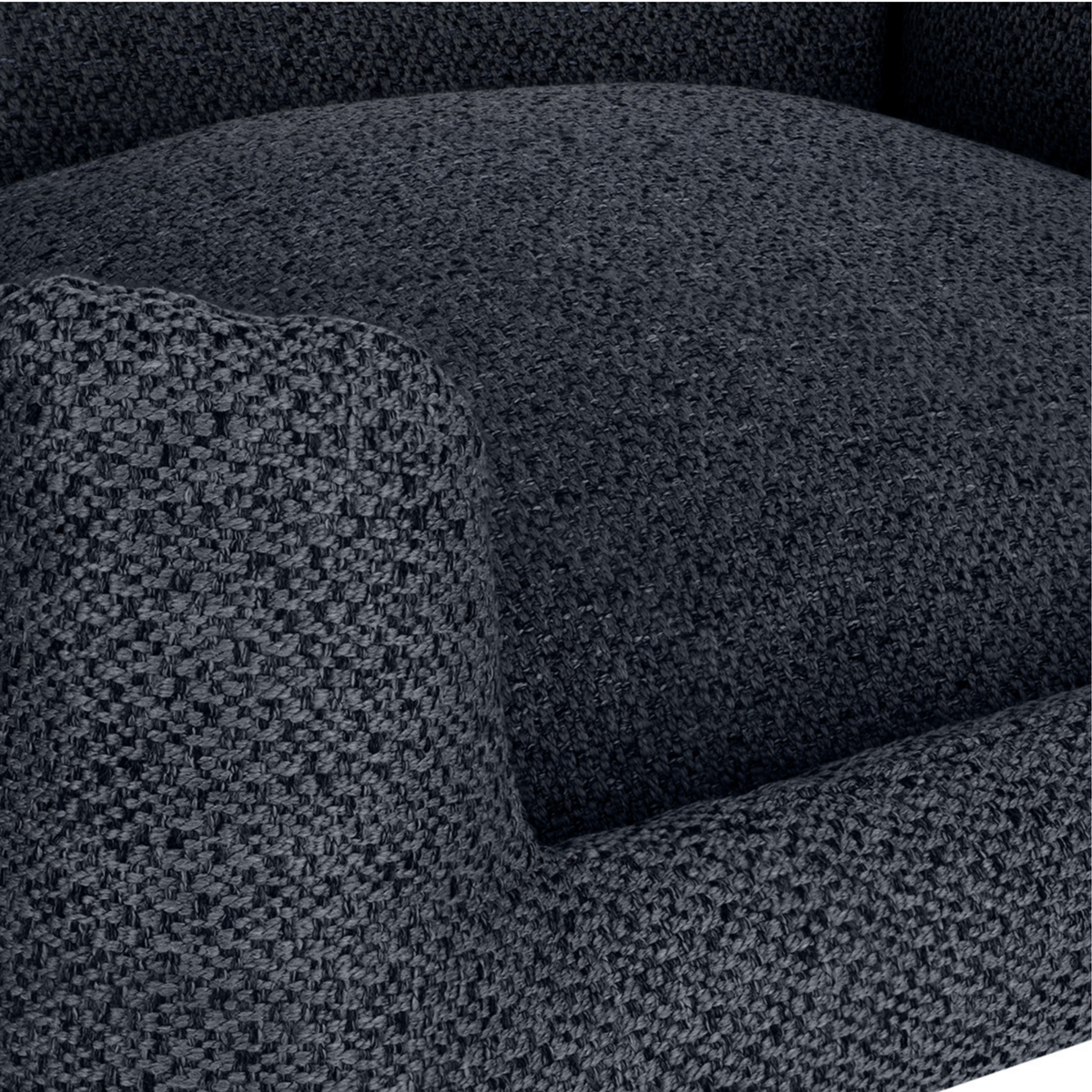 Close-up of a dark charcoal gray textured fabric armchair cushion and armrest.