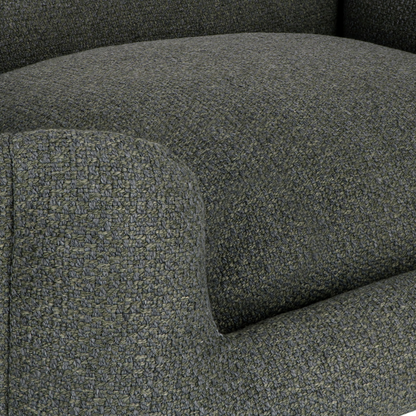 Close-up of a textured upholstered armchair in dark charcoal gray fabric, showing the seat cushion and rounded arm detail.