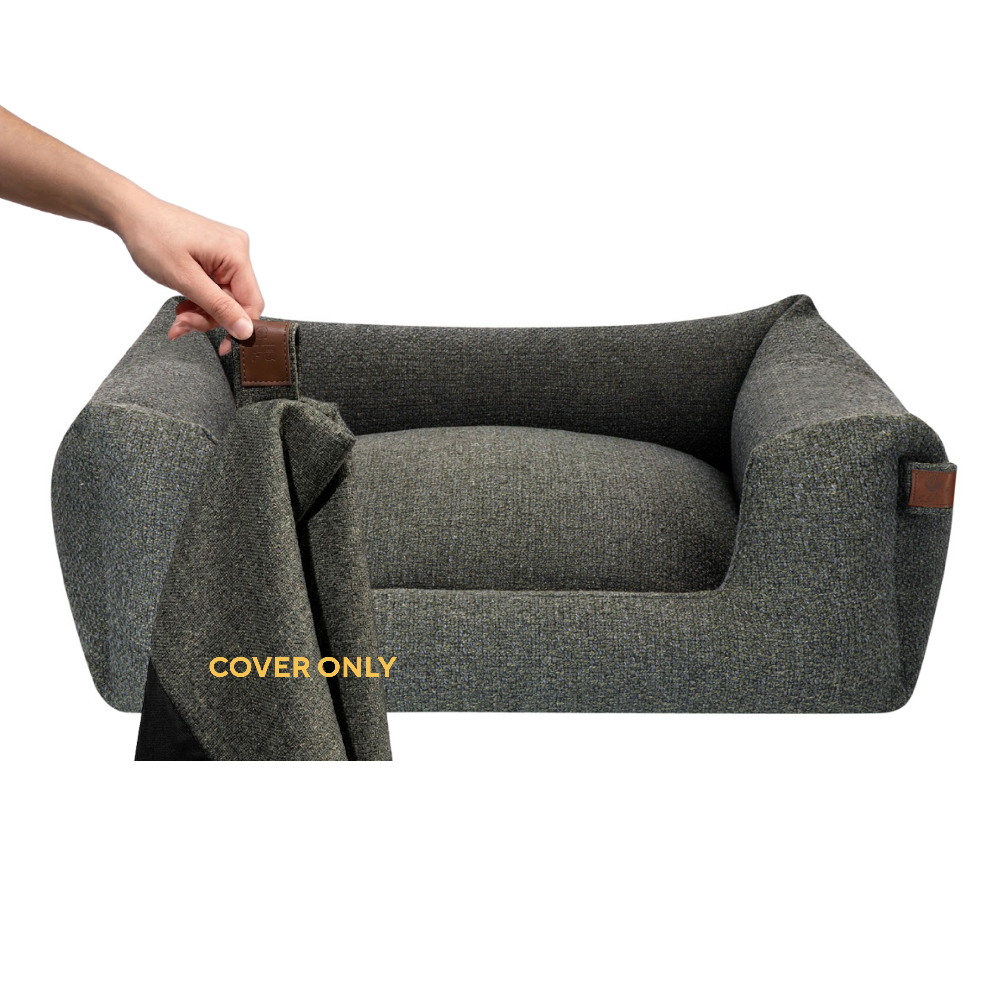 A dark gray textured pet bed with a raised armchair-style back and sides, shown on a white background. A human hand is pulling open a cover flap attached to the bed, and the words 'COVER ONLY' appear in yellow near the flap. 