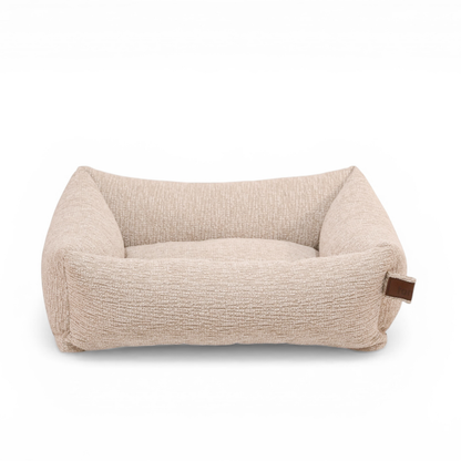 The Snug dog bed in Clay Beige, shown against a white background 