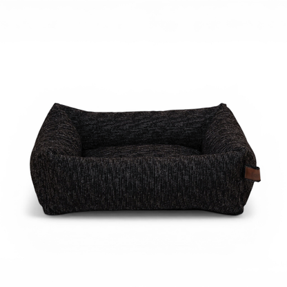 The Snug dog bed in Coal Grey, shown against a white background 
