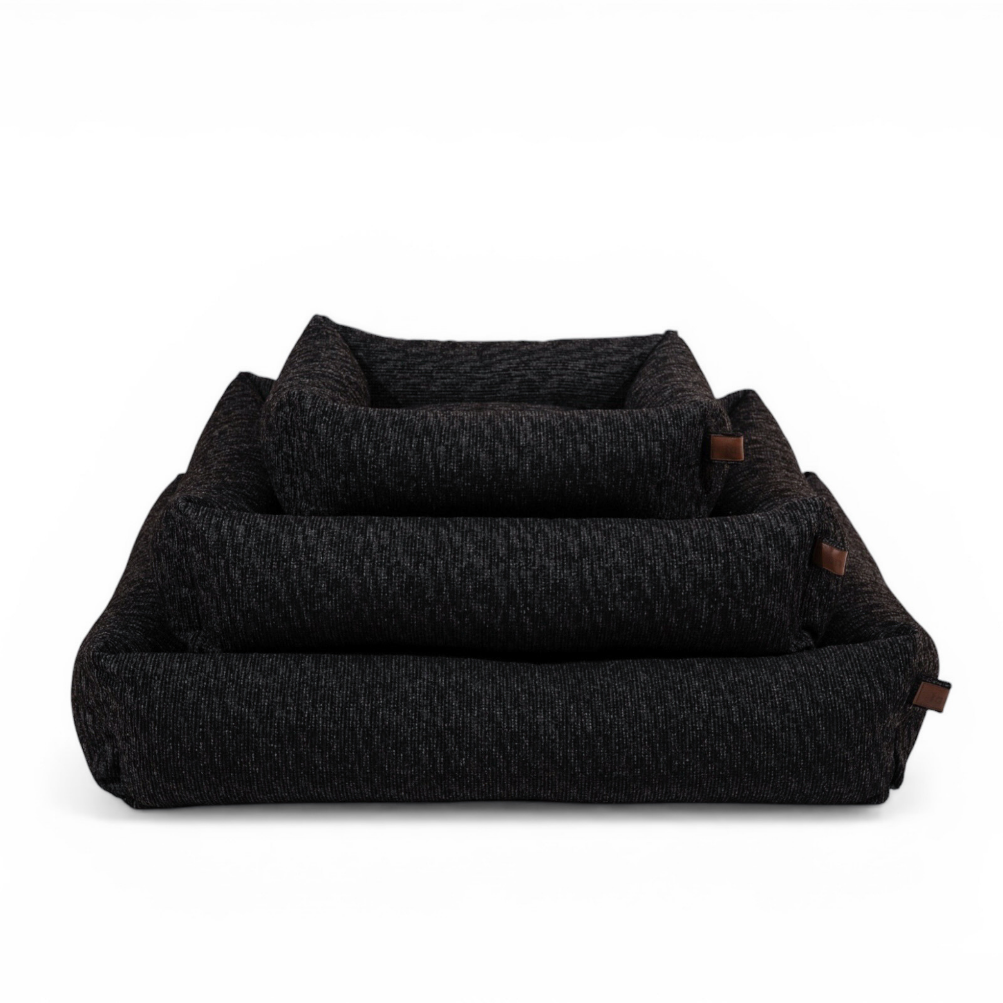 The Snug dog bed in Coal Grey in all three sizes, nested together 