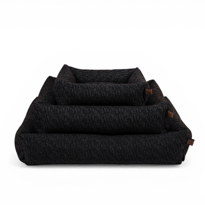 The Snug dog bed in Coal Grey in all three sizes, nested together 