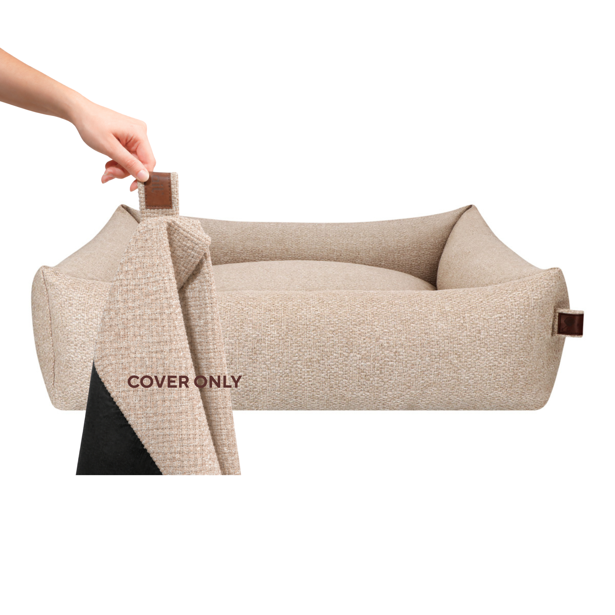 A hand lifting the removable cover off the Snug dog bed in British Tan, labelled Cover only #color_british-tan