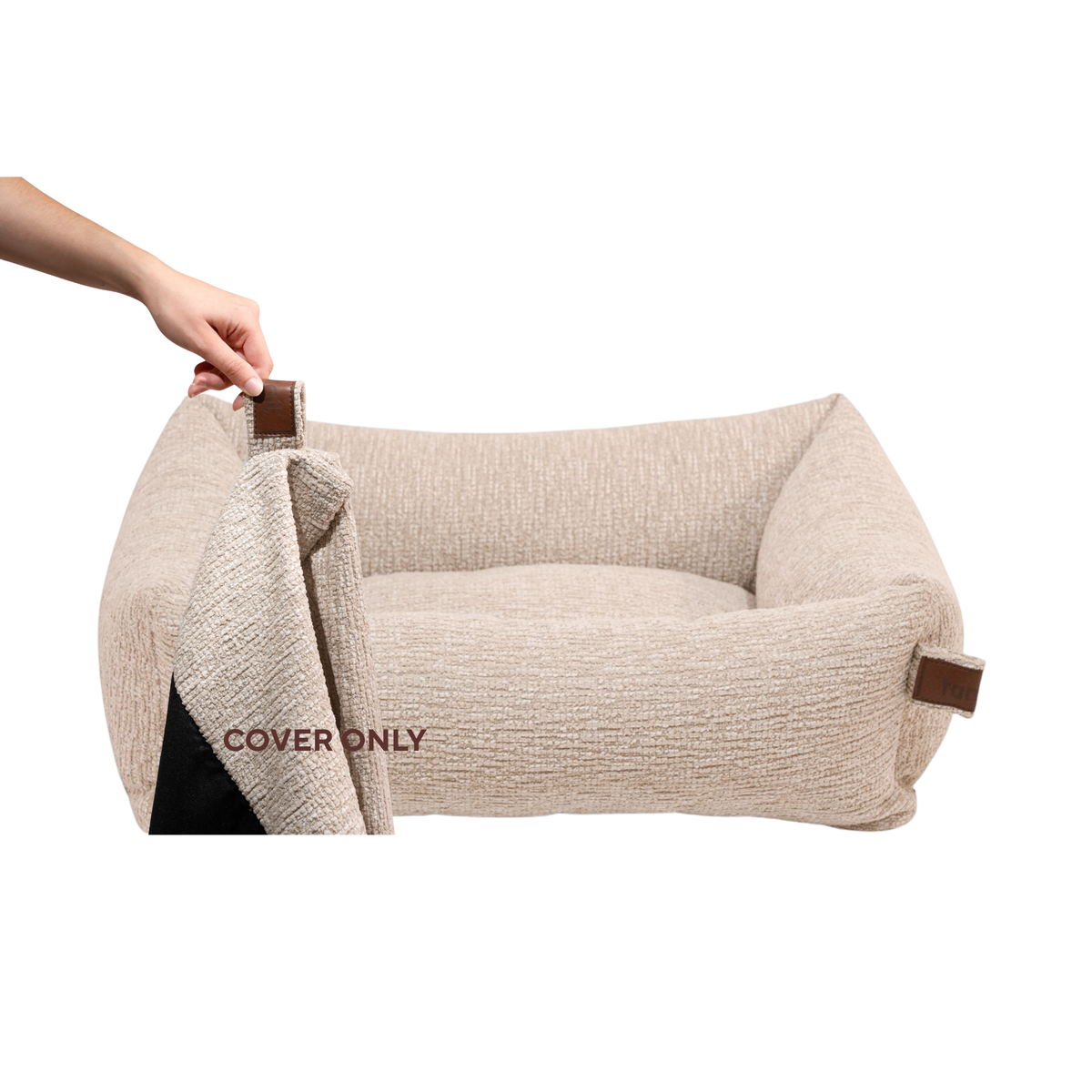 A hand lifting the removable cover off the Snug dog bed in Clay Beige, labelled Cover only 