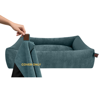 A hand lifting the removable cover off the Snug dog bed in Peacock Blue, labelled Cover only 