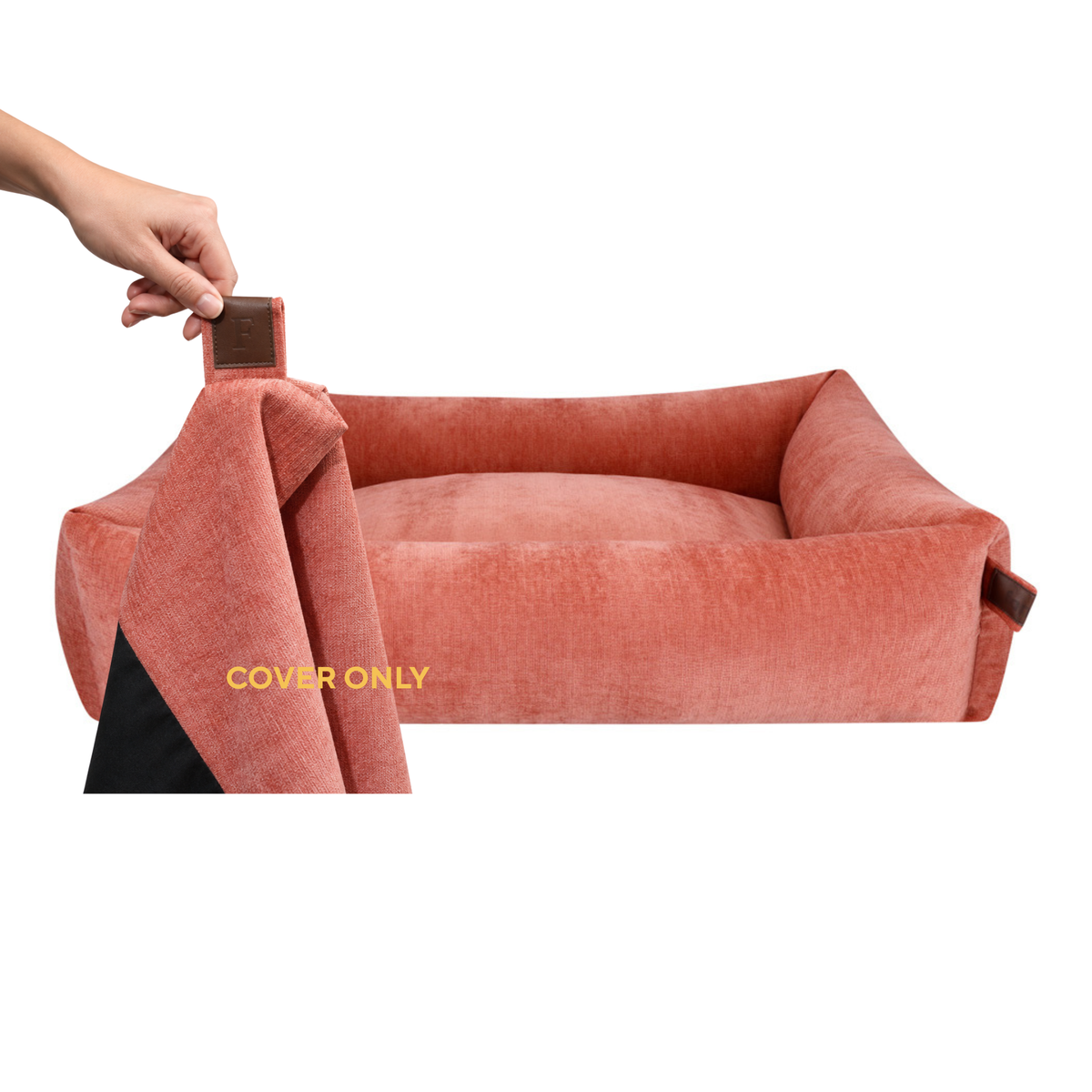 A hand lifting the removable cover off the Snug dog bed in Rusty Orange, labelled Cover only 