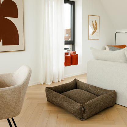 The Espresso Brown Snug dog bed in a bright living room 