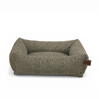 The Snug dog bed in Forest Green, shown against a white background 