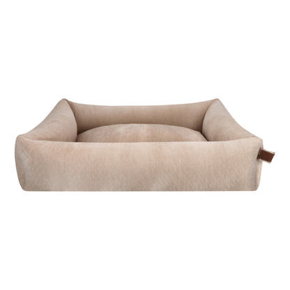 The Snug dog bed in Oat Beige, shown against a white background 
