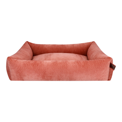 The Snug dog bed in Rusty Orange, shown against a white background 