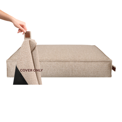 A hand lifting the removable cover off the Stargaze dog mattress in British Tan, labelled Cover only 