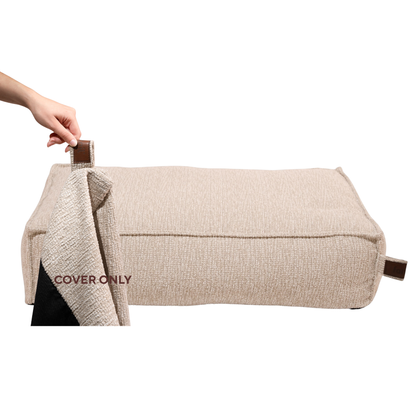 A hand lifting the removable cover off the Stargaze dog mattress in Clay Beige, labelled Cover only 