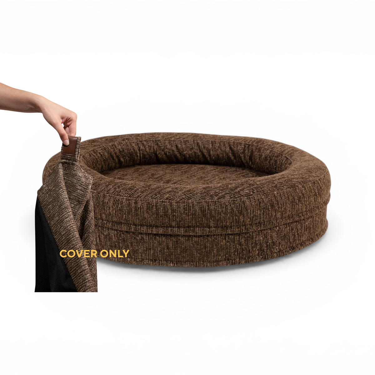 A hand lifting the removable cover off the round Swirl dog bed in Espresso Brown, labelled Cover only 